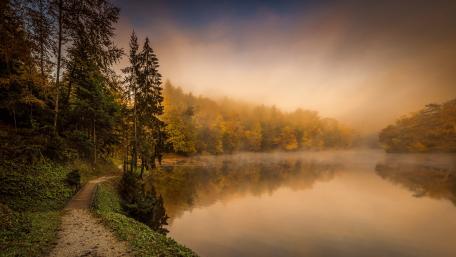Serene Autumn River in Foggy Landscape wallpaper