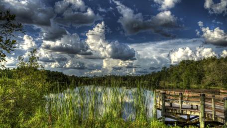 Tranquil Lake View with Dramatic Clouds wallpaper