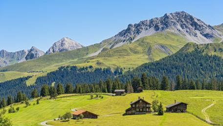 Alpine Serenity in a Picturesque Cottage Scene wallpaper