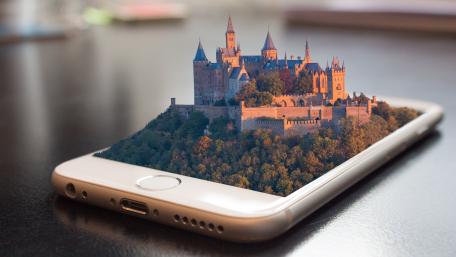Magical Castle Emerges from Smartphone Screen wallpaper