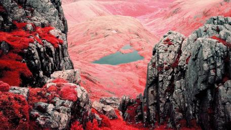 Dreamy Pink Mountainscape with Tranquil Lake wallpaper