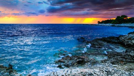 Stormy Sunset Over the Blue Sea wallpaper