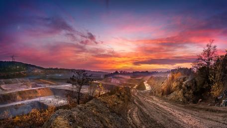 Vibrant Sunset Over Quarried Landscape wallpaper