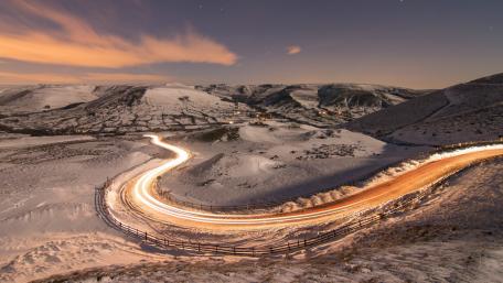 Winter Road Journey Through Snowy Landscapes wallpaper