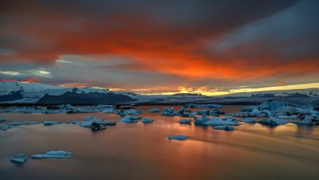 Serene Sunset Over Icy Waters wallpaper