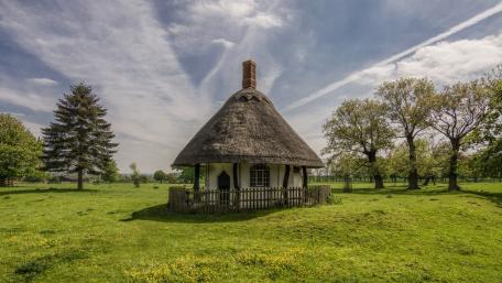 Charming Cottage in Serene Landscape wallpaper