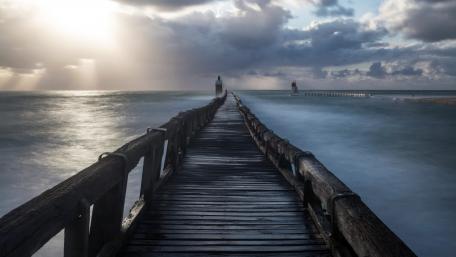 Serene Lighthouse Pier at Dusk wallpaper