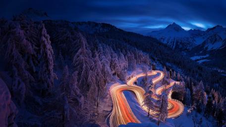 Winter Wonderland: Twilight on a Curved Mountain Road wallpaper
