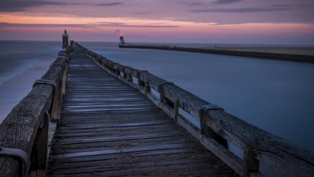 Ethereal Evening at the Lighthouse Pier wallpaper