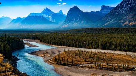 Majestic Mountains Embracing a Serene River View wallpaper
