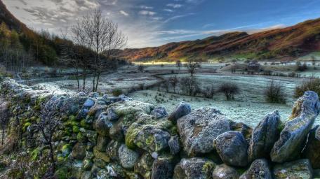Serene Stone Wall in Tranquil Landscape wallpaper