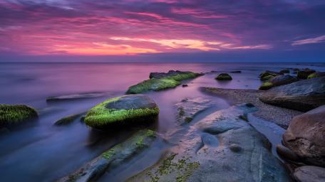 Magical Pink Sky Over Tranquil Shore wallpaper