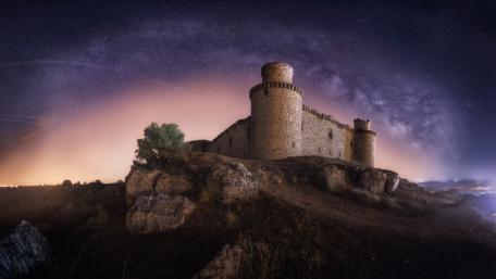 Ancient fortress under the milky way wallpaper
