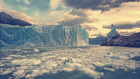 Majestic Glacier Under Dramatic Clouds wallpaper