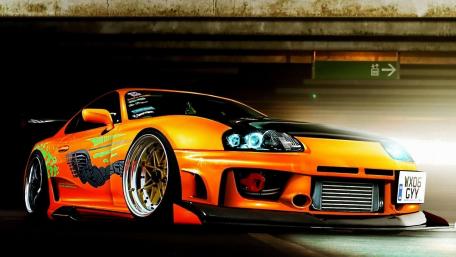 Gleaming Orange Supra in Urban Shadows wallpaper