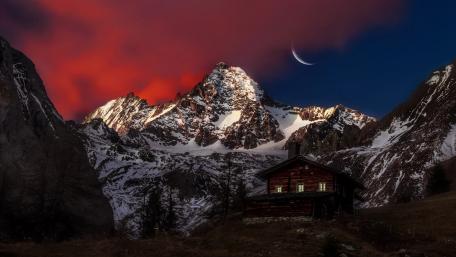 Serene Mountain Escape Under a Crescent Moon wallpaper