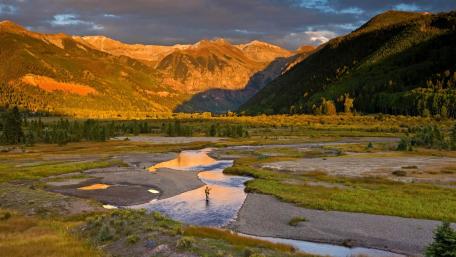 Tranquil Valley Fishing at Sunset wallpaper
