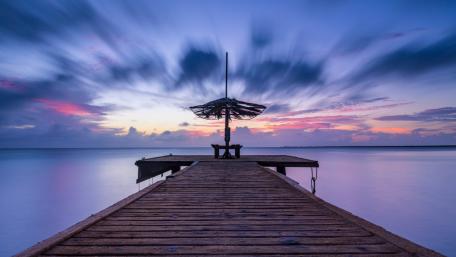 Serene Sunset Over Tranquil Pier wallpaper