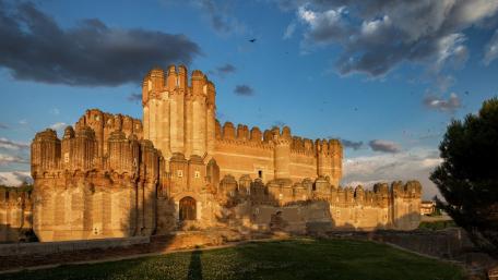 Majestic Castle Under a Cloudy Sky wallpaper
