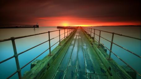 Serene Sunset Over Tranquil Pier View wallpaper