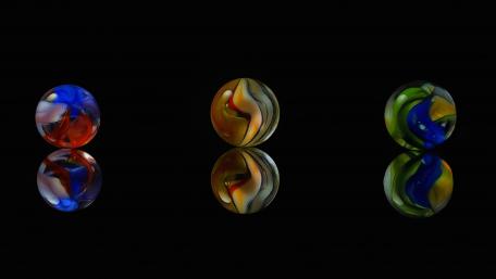 Colorful Glass Balls Against a Black Background wallpaper