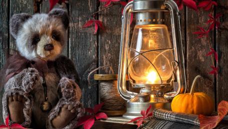Cozy Autumn Vibes with Teddy Bear and Lantern wallpaper