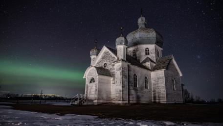 Majestic Temple Under the Arctic Lights wallpaper