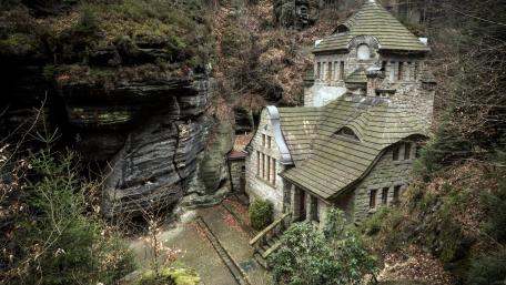 Charming Cottage Amidst Nature's Embrace wallpaper