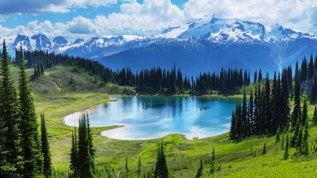 Serene Mountain Lake Under a Blue Sky wallpaper