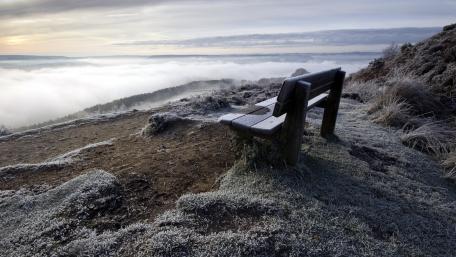 Serene Bench Above a Sea of Clouds wallpaper
