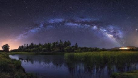 Serene Milky Way Over Tranquil Waters wallpaper