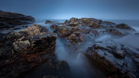 Misty Cliffs and Serene Waterscape wallpaper