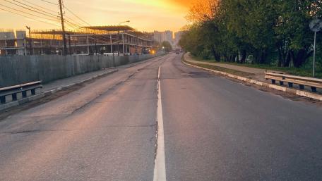 Peaceful Sunset Over Empty City Road wallpaper