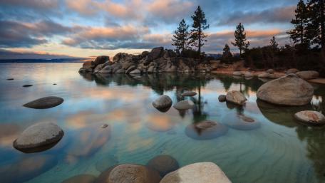 Serene Reflections at a Tranquil Lake wallpaper