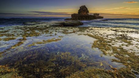 Serene Coastal Sunset Over Calm Waters wallpaper