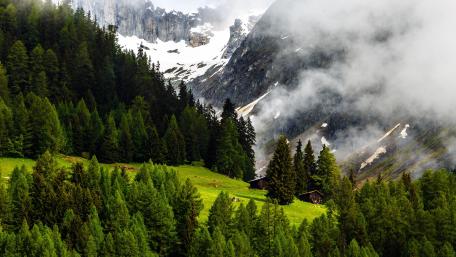 Serene Mountain Valley with Cozy Cabin View wallpaper