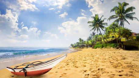 Tranquil Tropical Beach Scene with Boat wallpaper
