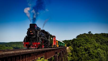 Classic Steam Locomotive Overlooking Scenic Vistas wallpaper