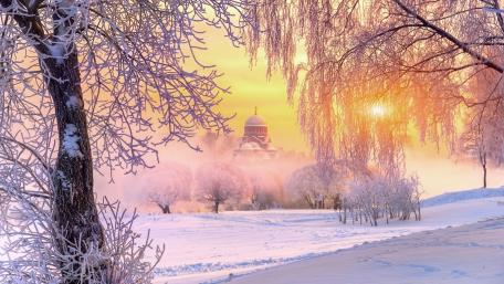 Serene Winter Church in a Snowy Landscape wallpaper