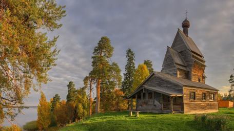 Serene Wooden Church Amidst Nature wallpaper