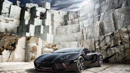 Sleek Black Lamborghini in an Elegant Setting wallpaper