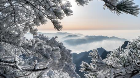 Winter Wonderland Amidst Majestic Peaks wallpaper