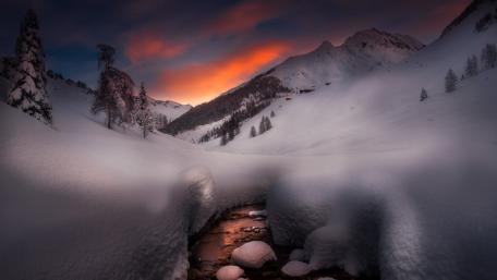 Winter's Embrace in a Snowy Valley wallpaper