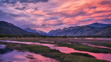 Serene Highland Sunset Over Wetlands wallpaper