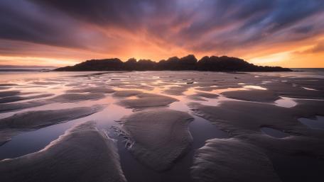 Serene Sunset Over Coastal Waters wallpaper