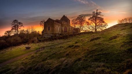 Abandoned Church at Sunset in Serene Nature Scene wallpaper