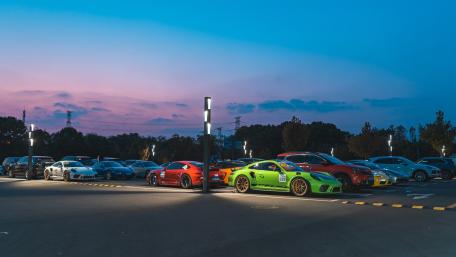 Dusk Gathering of Elite Race Cars wallpaper