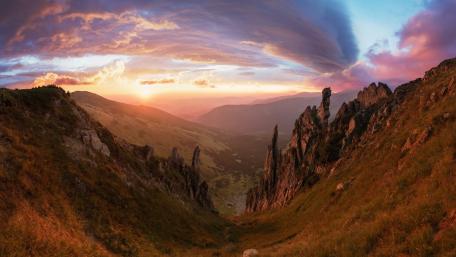 Majestic Valley at Sunset Over Rock Formations wallpaper