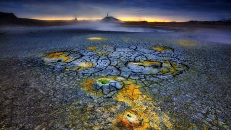 Dramatic Dusk Over a Volcanic Lava Field wallpaper