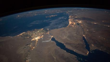 Earth from orbit showcasing stunning landscapes at night wallpaper